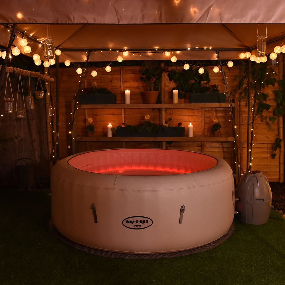 Inflatable hot tub decorated with lanterns and candles