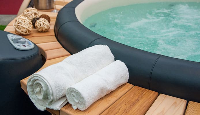 Inflatable hot tub with extra seating
