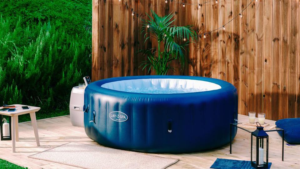 Inflatable hot tub with potted plants