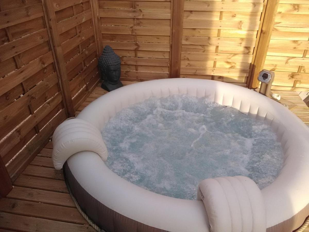 Inflatable hot tub in a log cabin