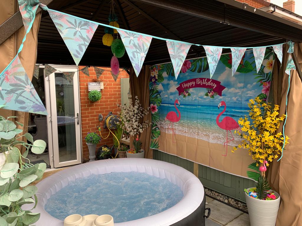Outdoor hot tub with buntings for celebration