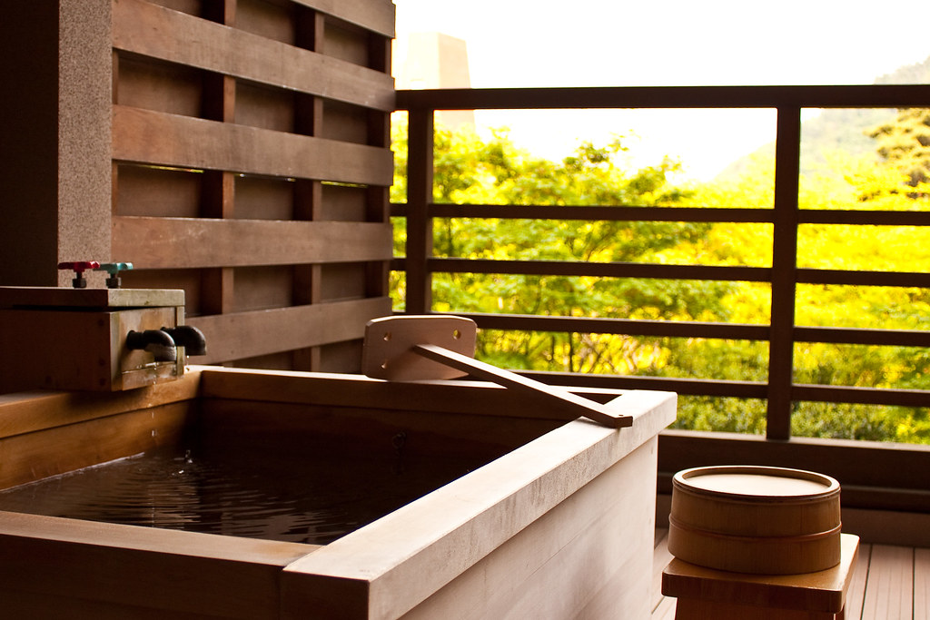 Ancient style wooden hot tub on a balcony