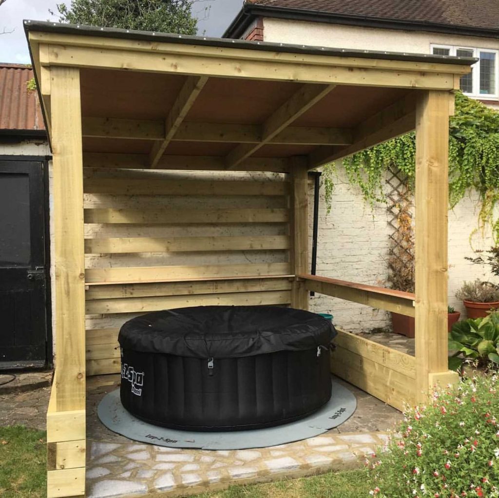Inflatable hot tub tucked in a wooden gazebo