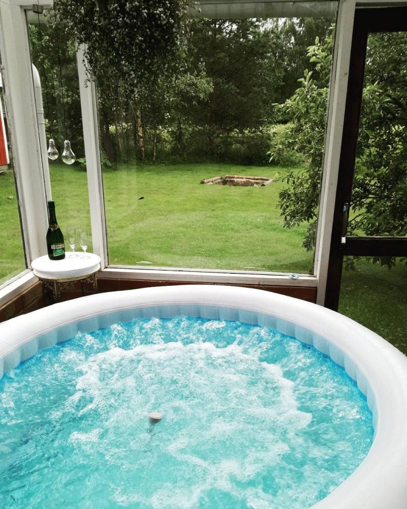 Inflatable hot tub in a conservatory
