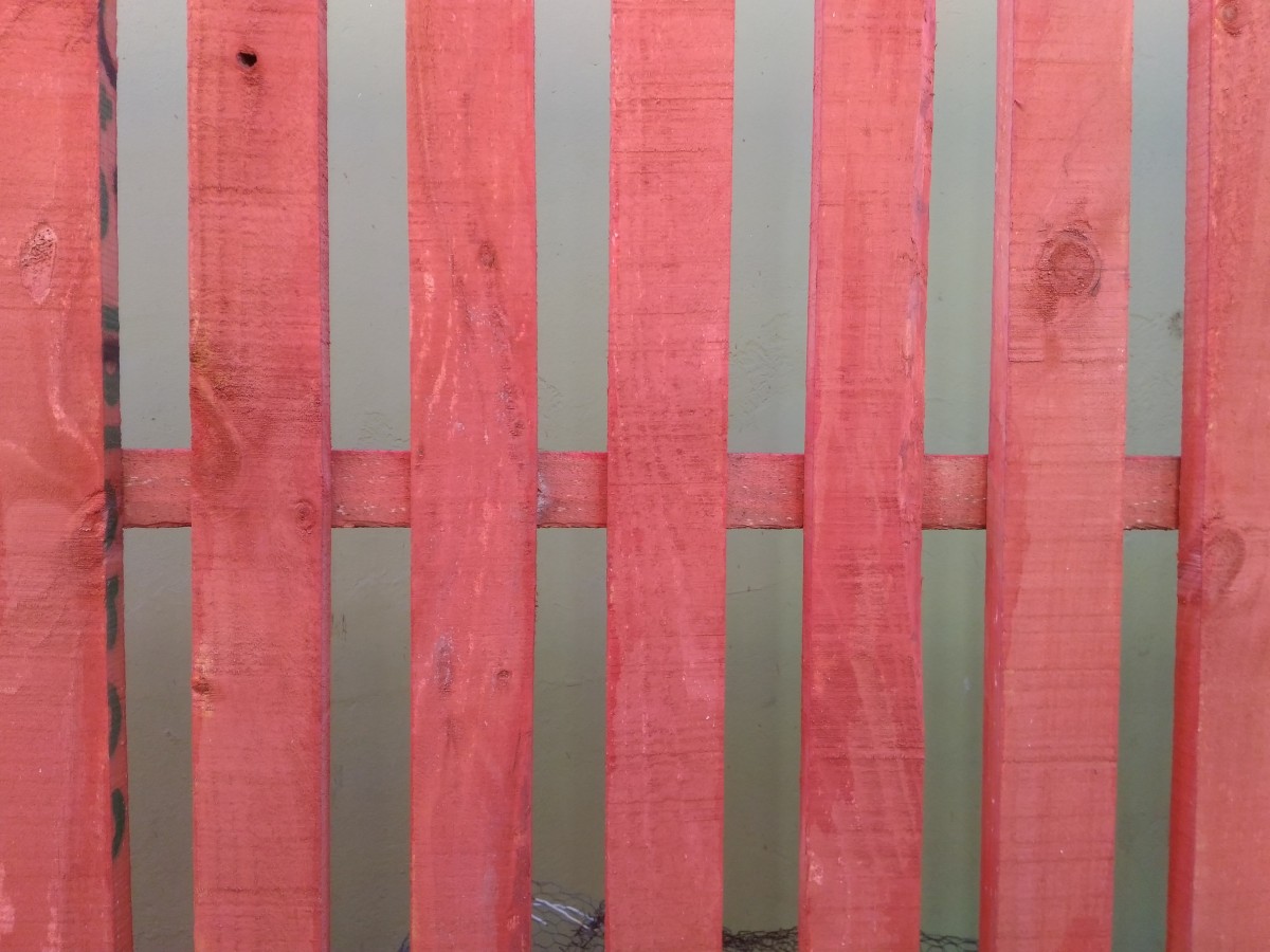 Pink painted garden wooden fence