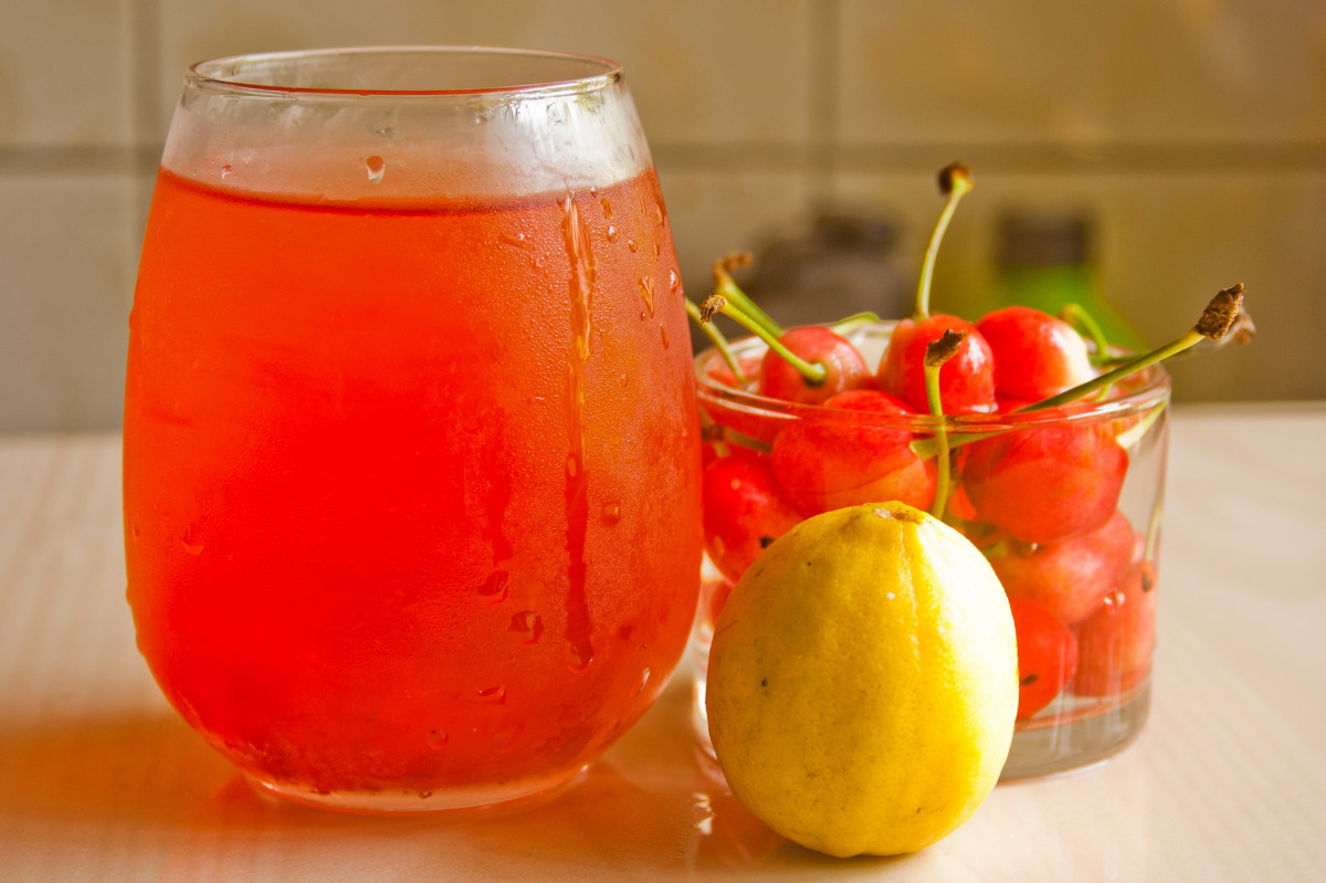 Summer punch drink with cherries and a lemon