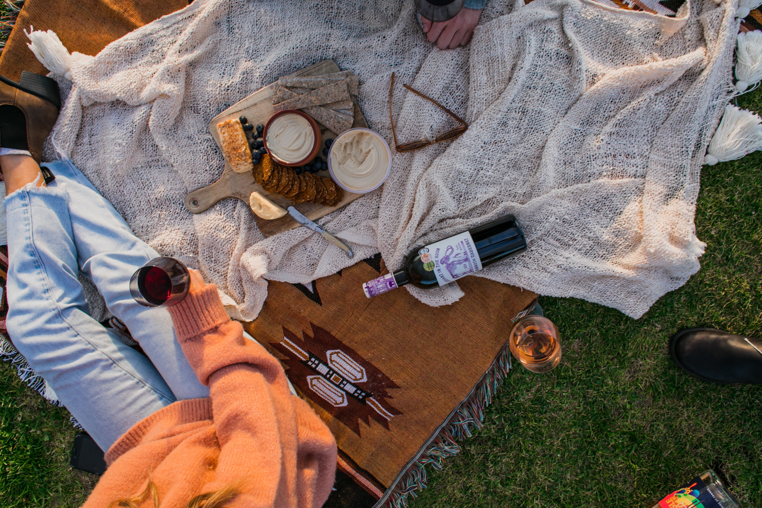 A woman having picnic with wine