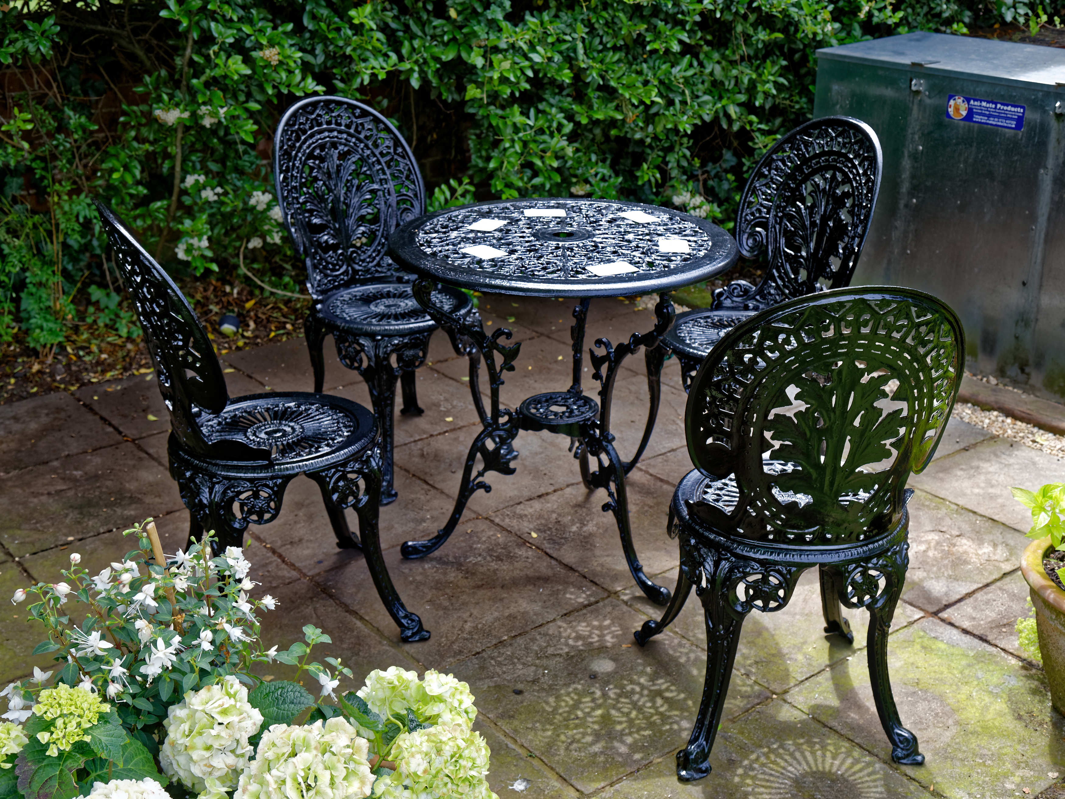 Wrought iron garden table and chairs in black finish