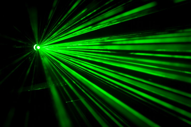 Green laser lights in the darkness