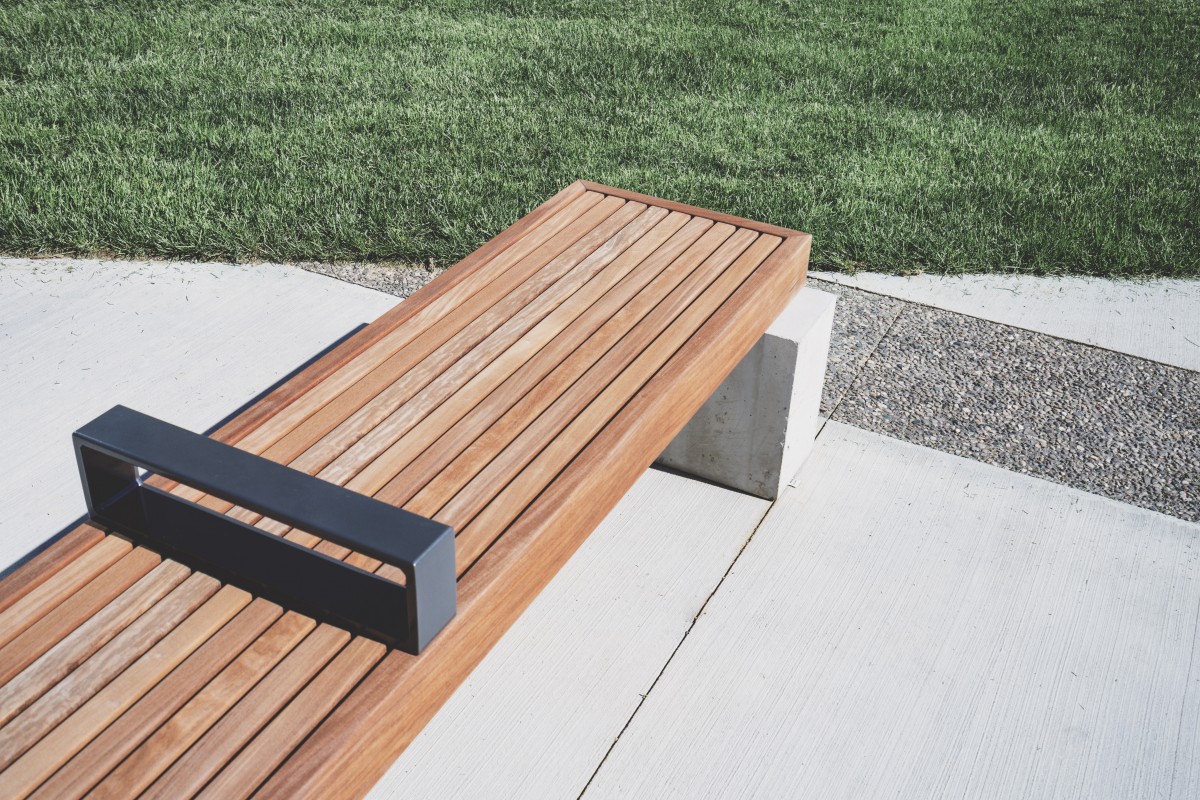 Wood, concrete, and metal bench