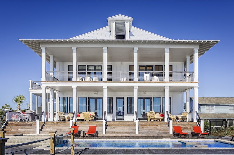 Luxurious white two-storey pool house