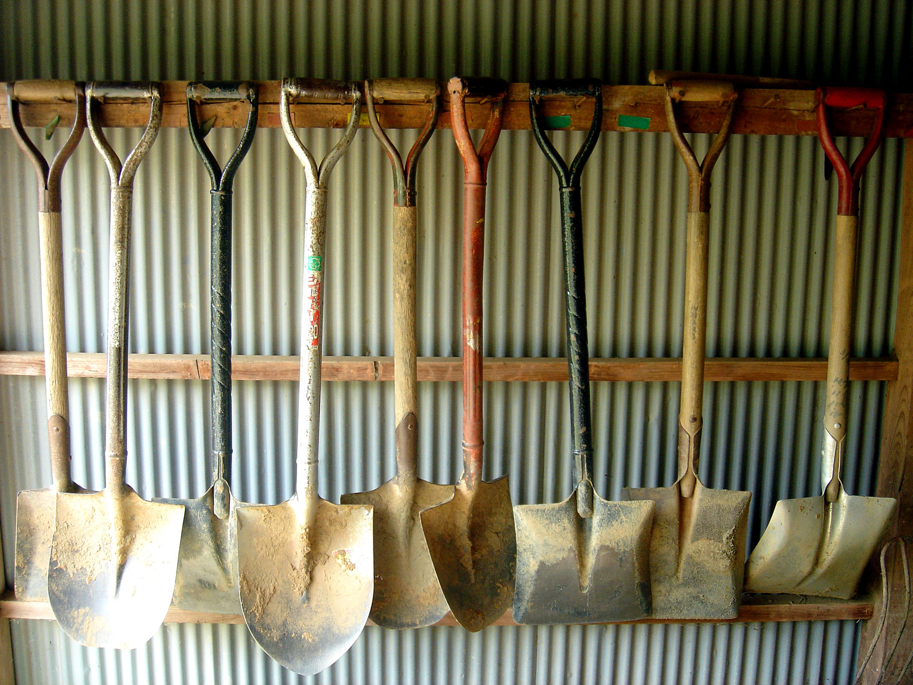 Shovels on a hanging rack