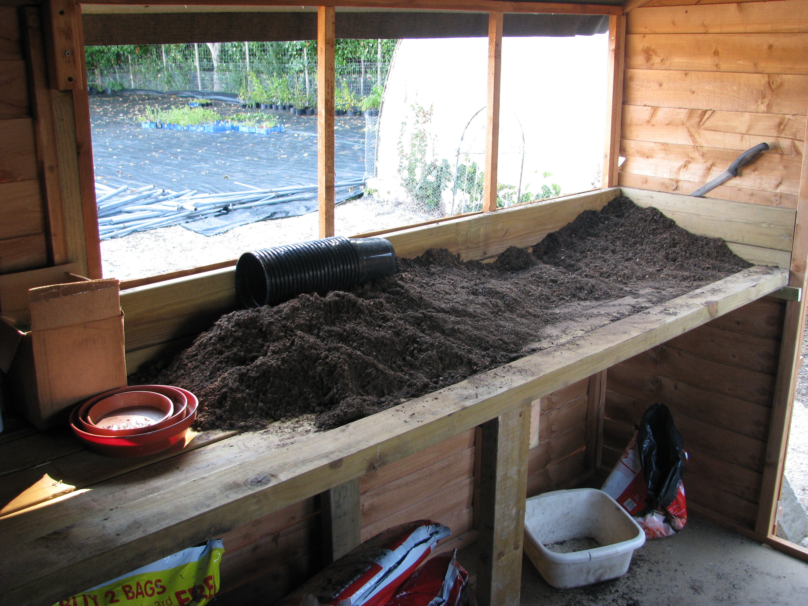 Soil all over a potting bench