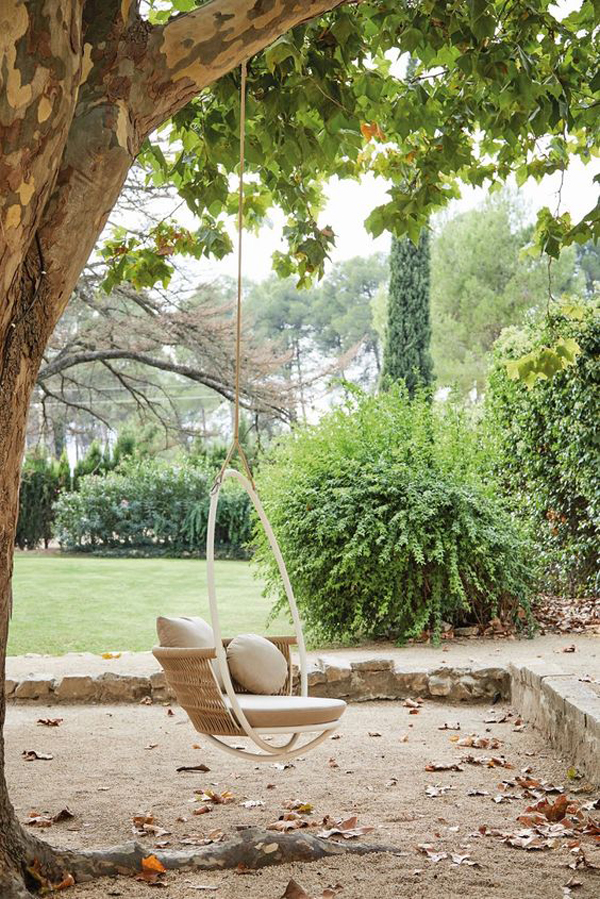 French garden design with a swing chair