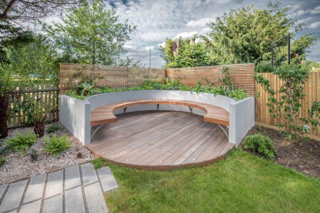 Small garden decking in contemporary circular style