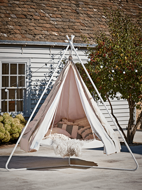 Summer garden idea with a tepee for backyard camping