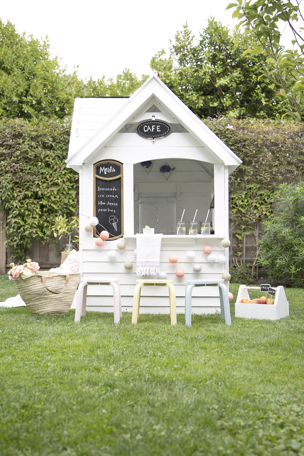 Summer garden idea with a DIY playhouse for the kids