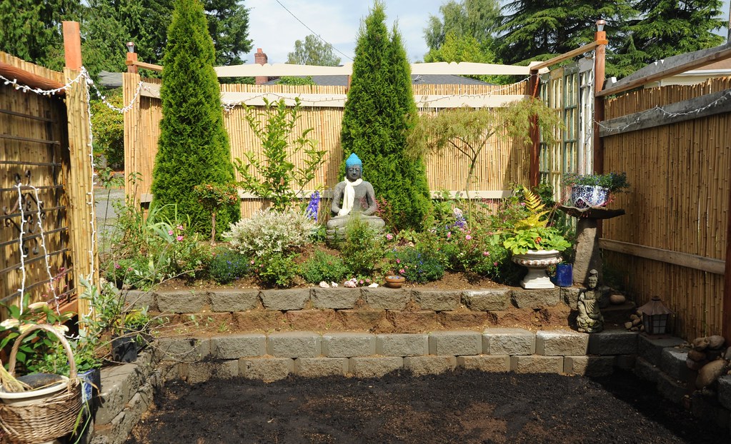 Cinder blocks as retaining wall in a small garden