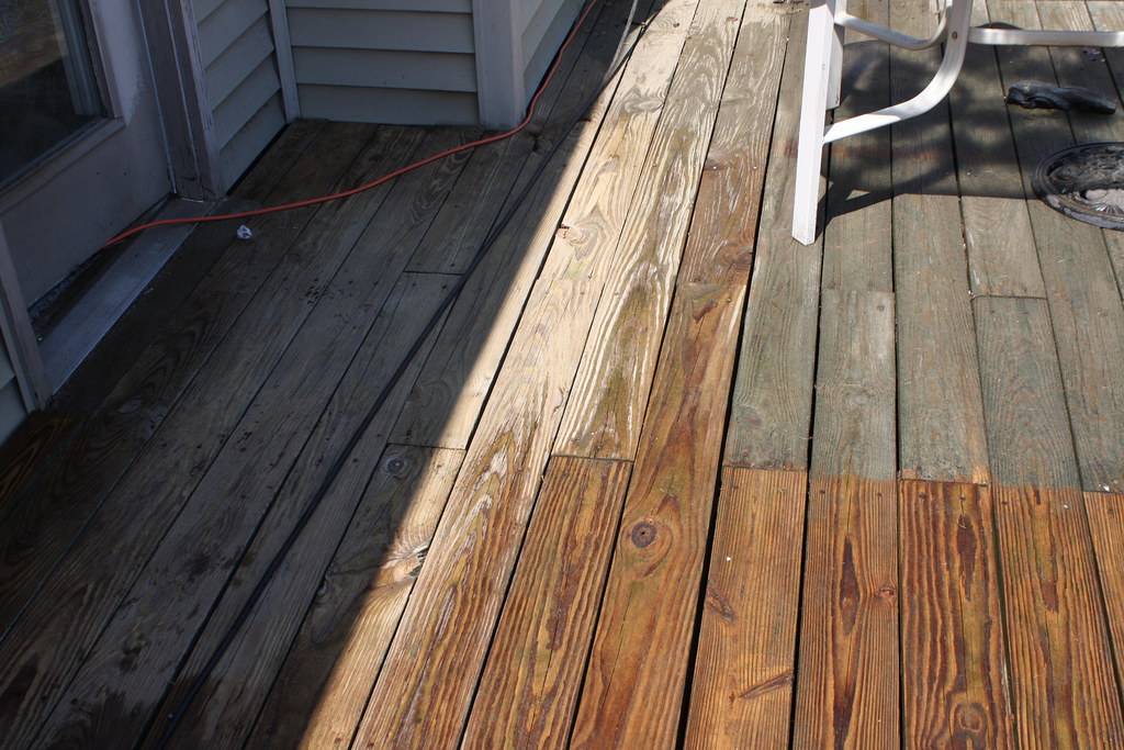 A deck before and after a pressure wash