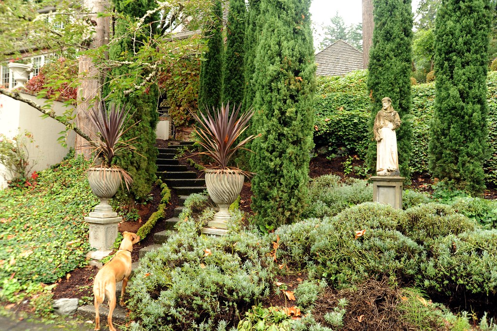 Tiered Victorian garden with urns along the stairs