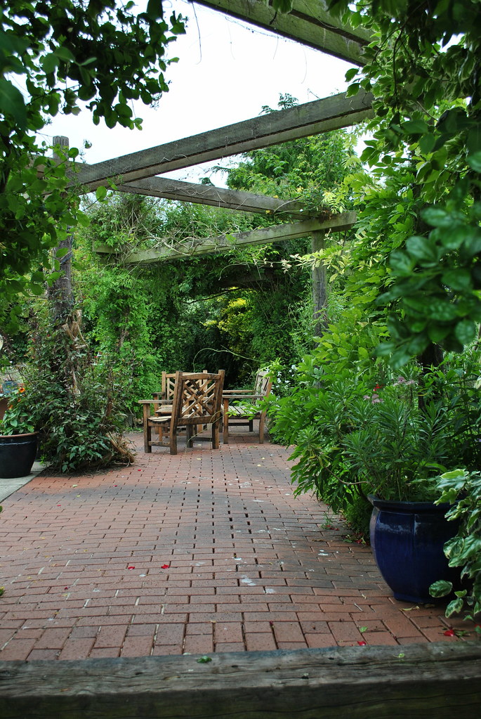 Paved pergola with seating area