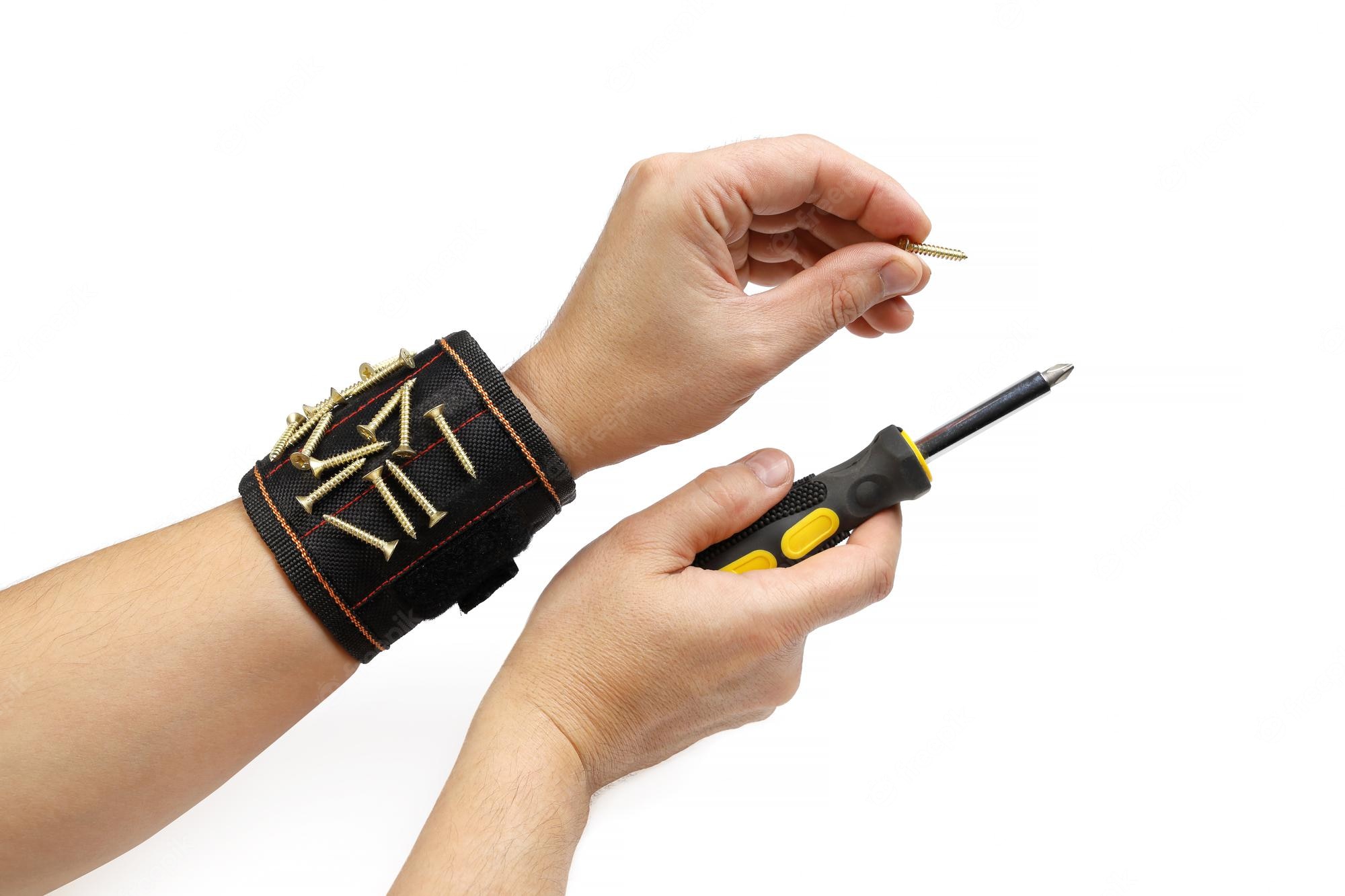 A person wearing a magnetic tool wristband on the left hand and holding a screwdriver on the right hand