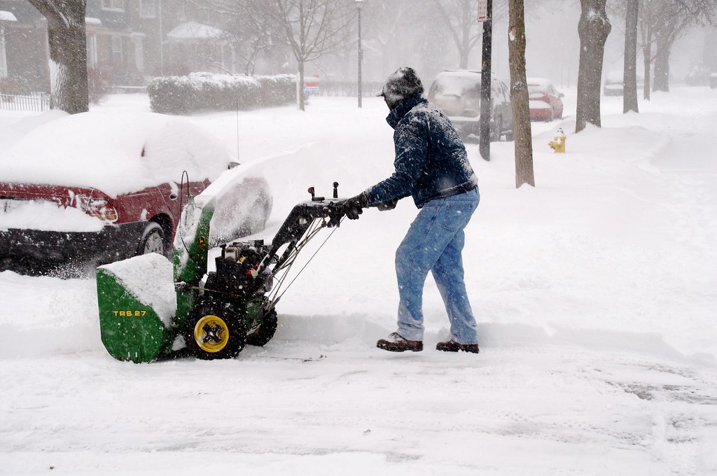 A man using a snow plough