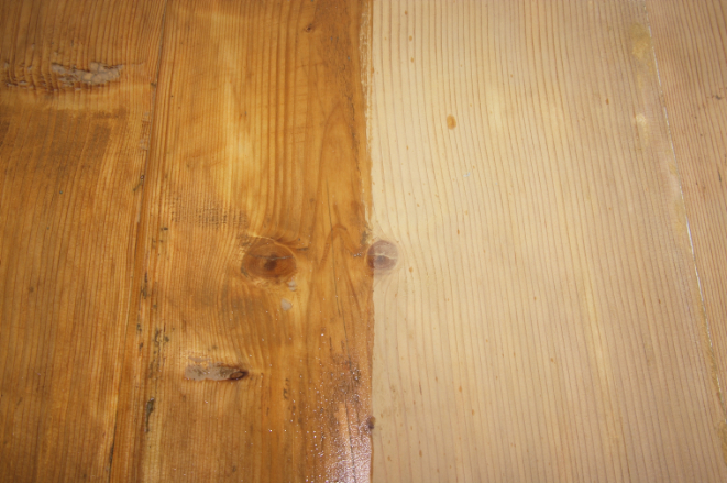 Two wooden surfaces side by side, one treated with a wood oil (darker) and the other untreated (lighter).