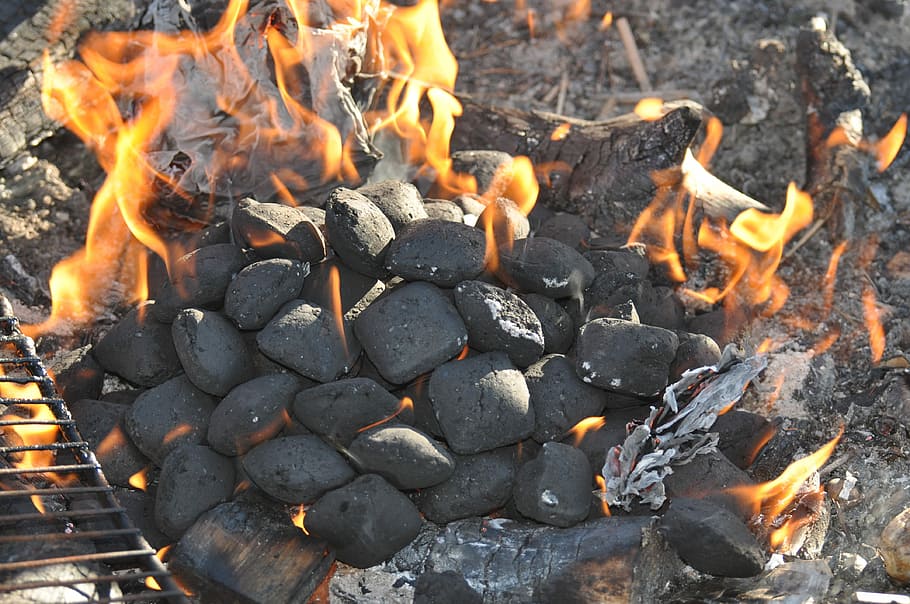 Lit charcoal briquettes
