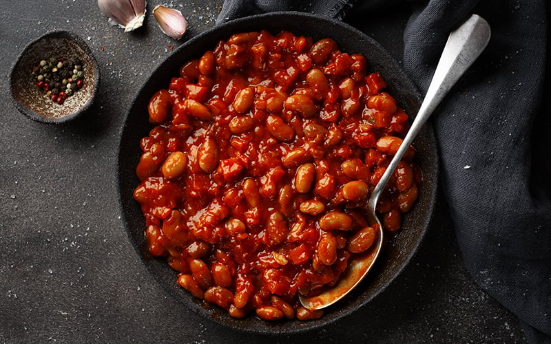 Baked beans on a skillet.