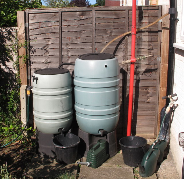 Two water butts used for domestic rainwater conservation.