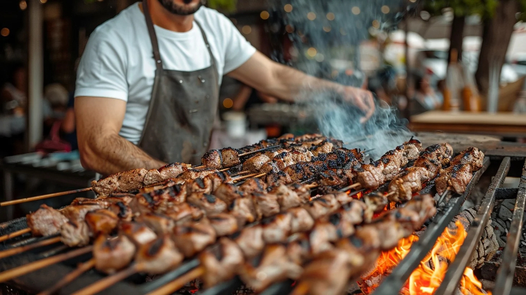 Grilling skewers over an open flame.