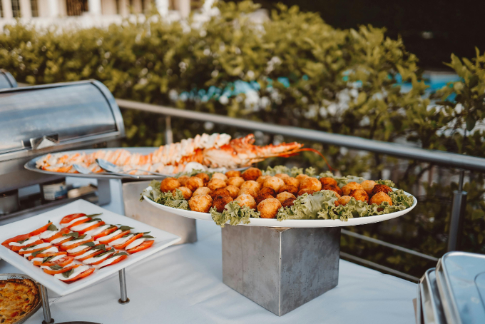 A variety of food on a buffet table.